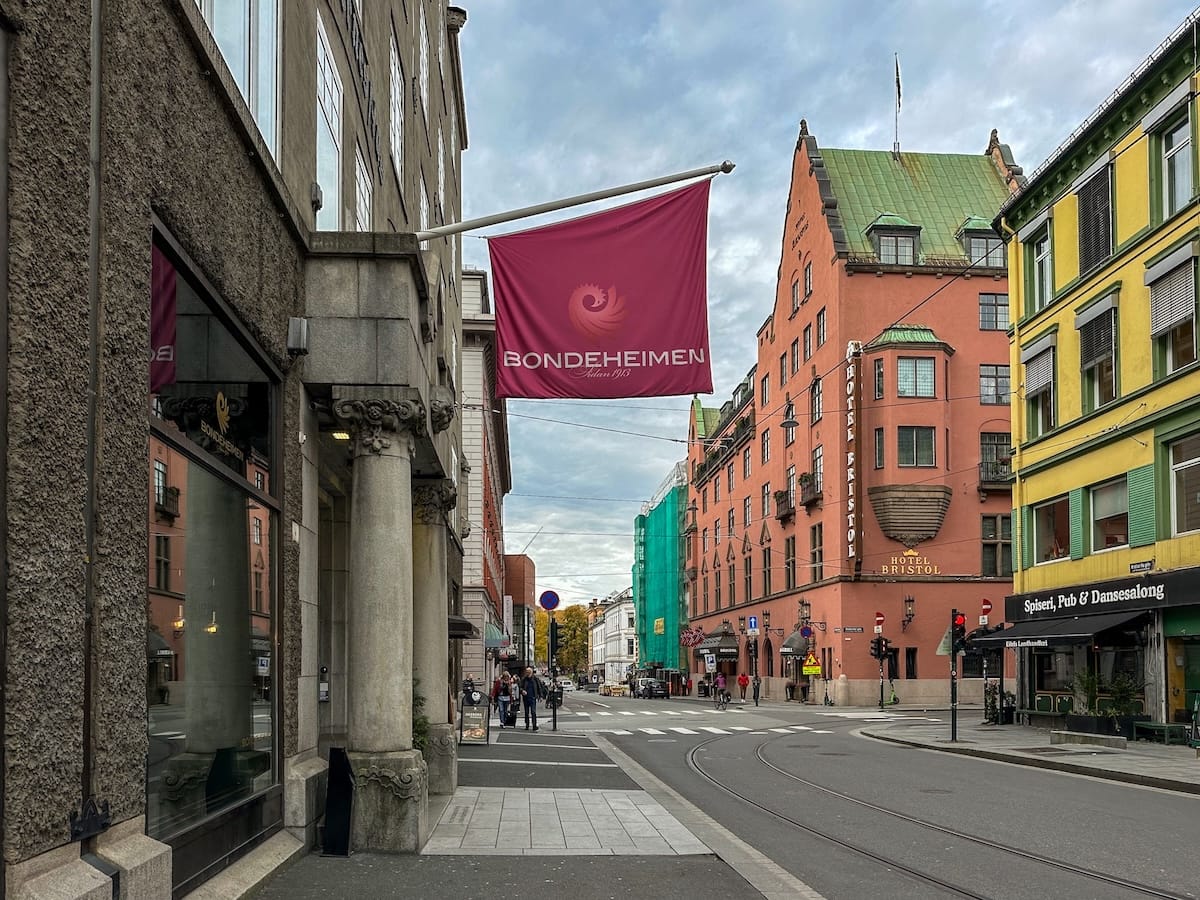 a hotel flag outside of a building in a city center