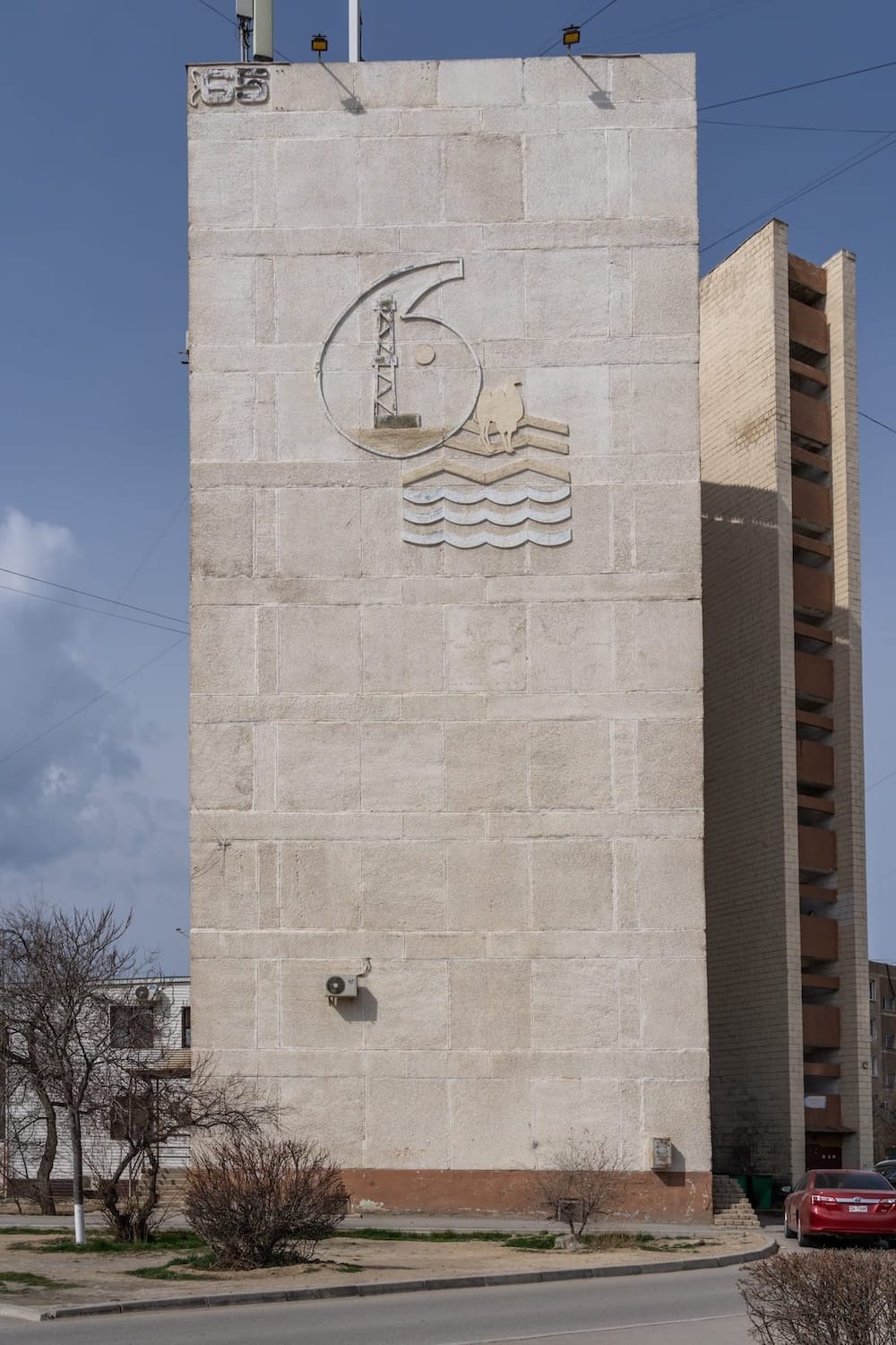 a soviet-era relief on an apartment building in aktau