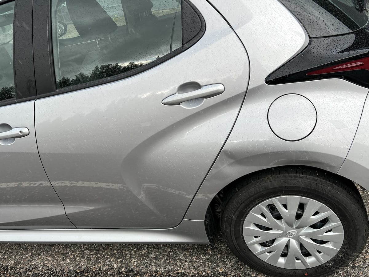 a dent on a silver car in finland