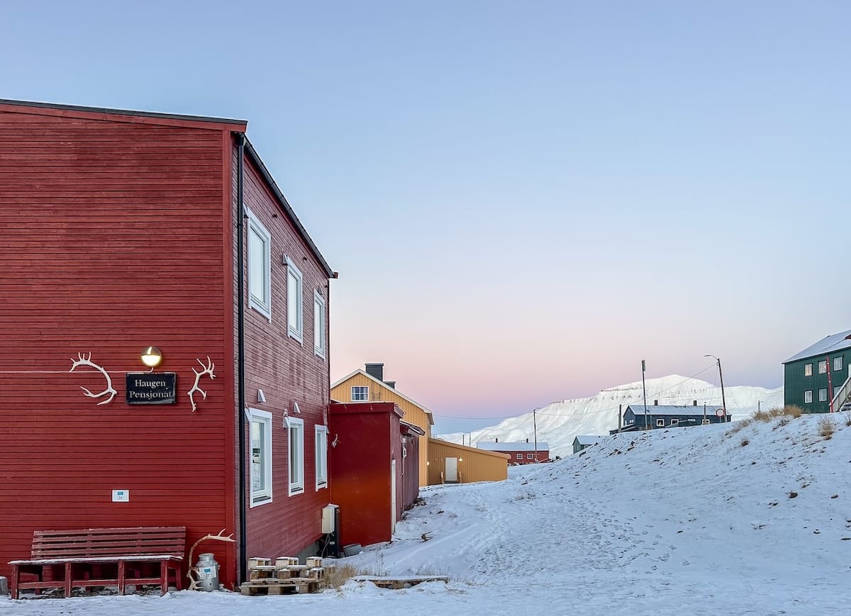 a red building that is a guesthouse in svalbard