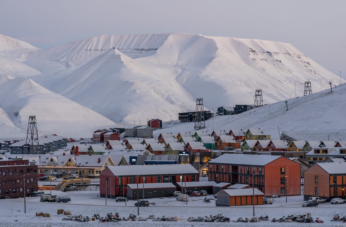 October in Svalbard ; views over the town of longyearbyen with clear skies and snow on the mountains