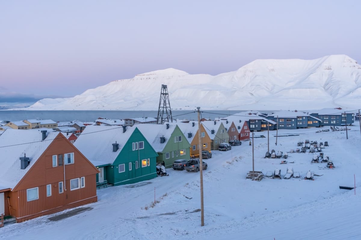 Svalbard in October (a view over the city with snow and colorful buildings)