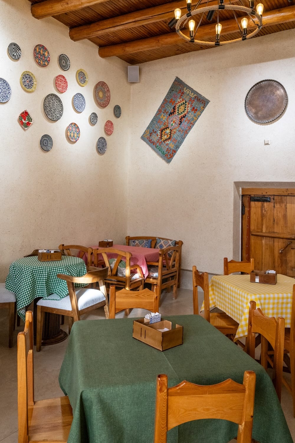 Inside Donuts and Coffee
the interior of a cafe with uzbek decor on the walls