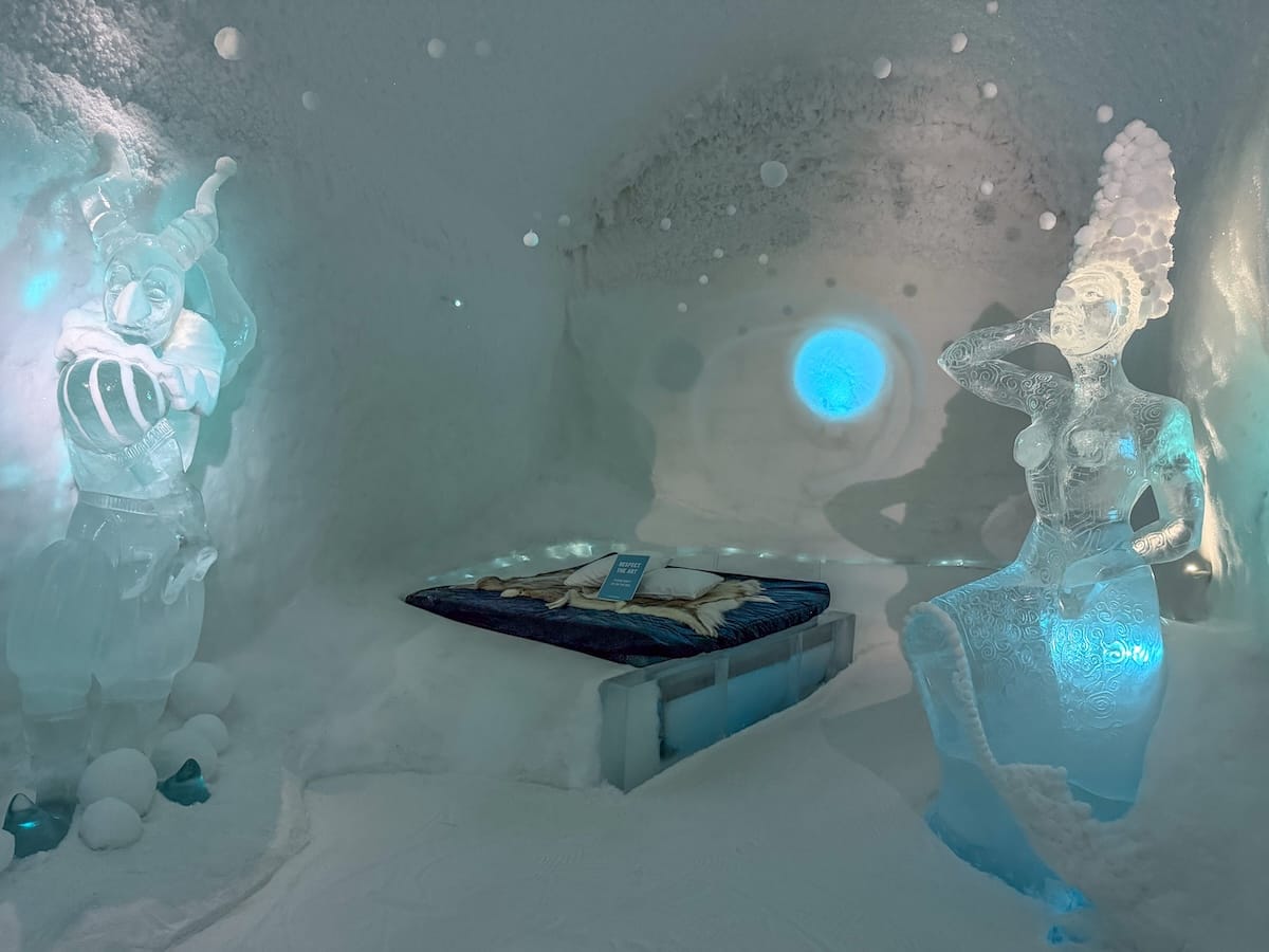 a room made of ice and snow at an ice hotel in Sweden