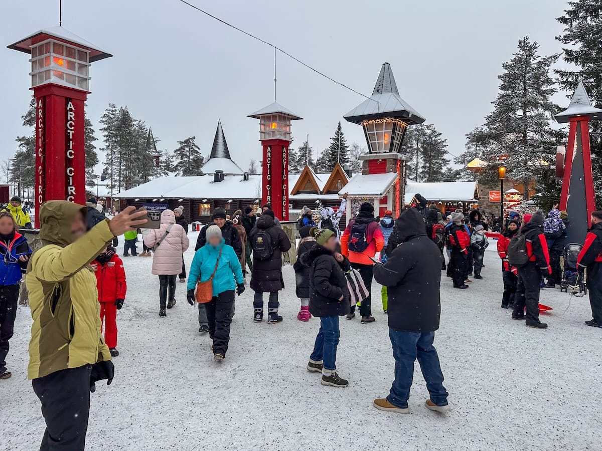 crowded santa claus village in winter