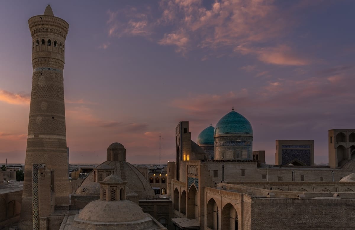 Is Bukhara worth visiting? Pros & Cons of a trip to Bukhara. a photo of the city scape of bukhara at dusk