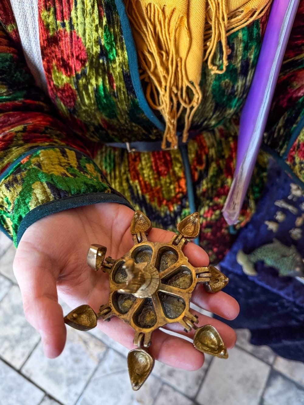 Kamilla showing me an ink holder in Bukhara
a woman's hand showing an old ink holder in uzbekistan