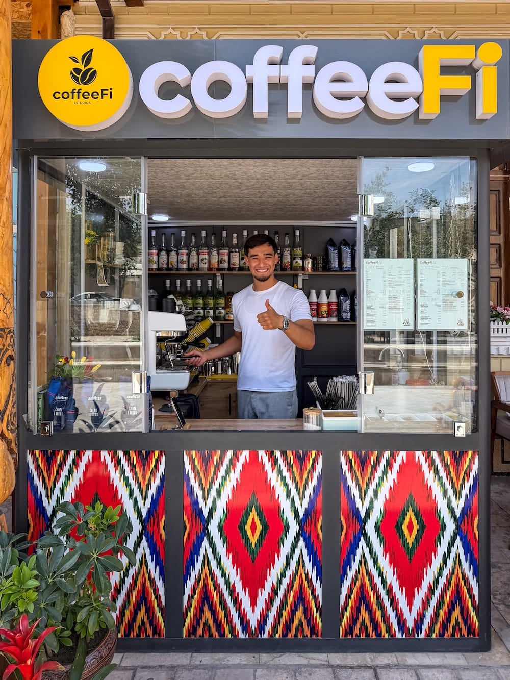 coffeeFi in Bukhara
a man standing in his kiosk coffee shop in uzbekistan