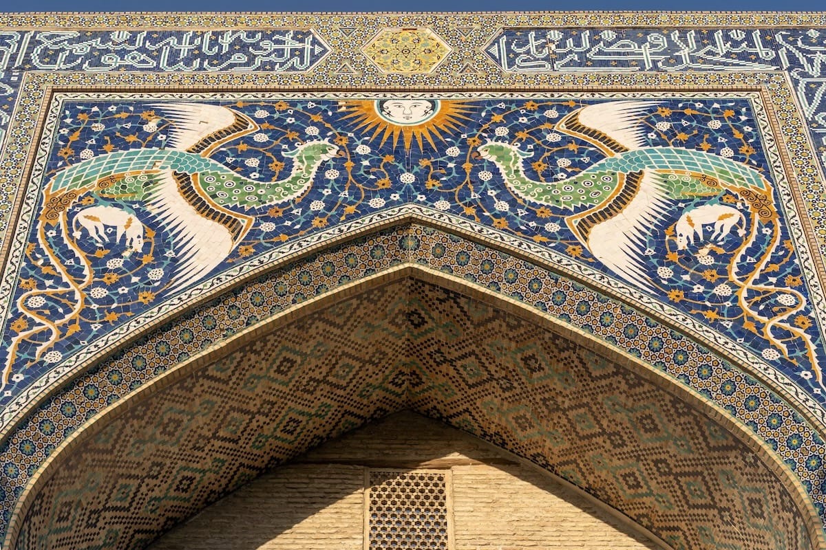Close-up of mythical phoenix birds and sun face mosaic on the Nadir Divan-Begi Khanaka at Lyab-i Hauz, Bukhara, Uzbekistan