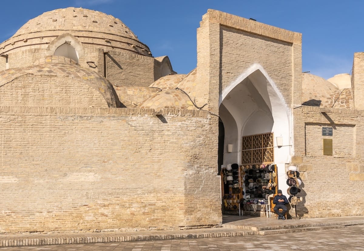 Domed exterior of Toqi Telpakfurushon trading dome with a hat shop at its entrance in Bukhara, Uzbekistan