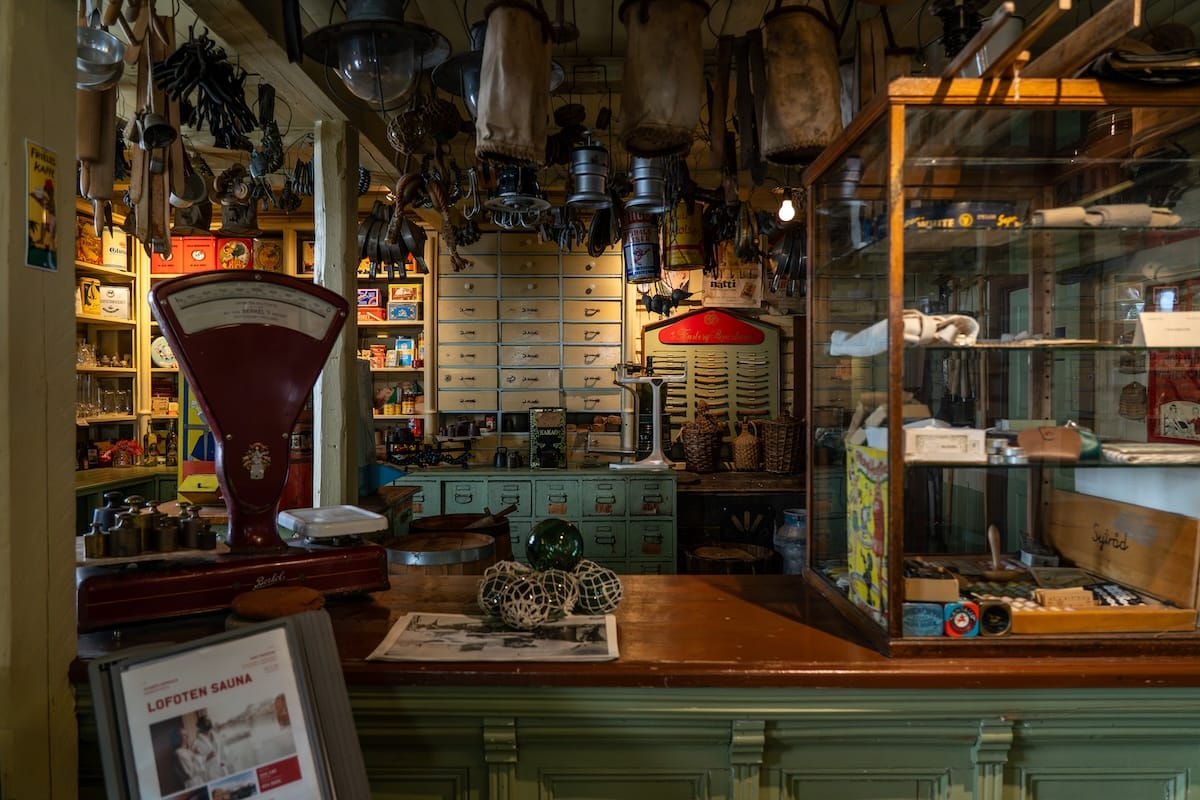 Historic trading post interior on Svinøya, Svolvær, with an old red scale, wooden drawers and vintage goods